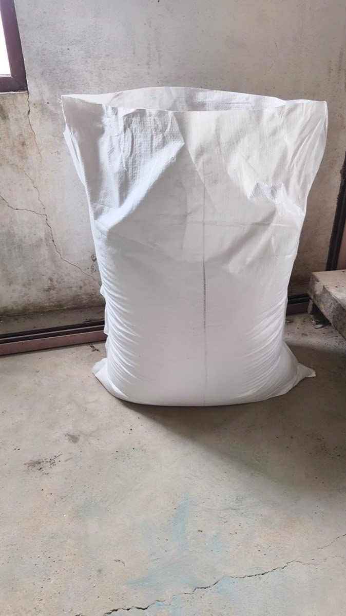 Cow dung powder packed in a woven bag